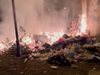 Незаконно сметище горя между блокове в Пловдив (Снимки, Видео)
