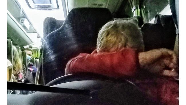 A bus driver falls asleep and staggers to the guardrail.  It almost crashed