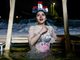 Русия отбеляза Богоявление с потапяне в ледени води (Снимки)