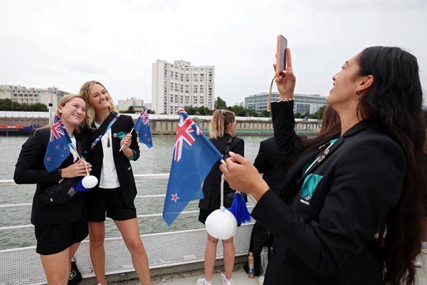 Athletes from New Zealand pose for a photo on a boat before the opening ceremony of the Olympic Games Photo: Reuters