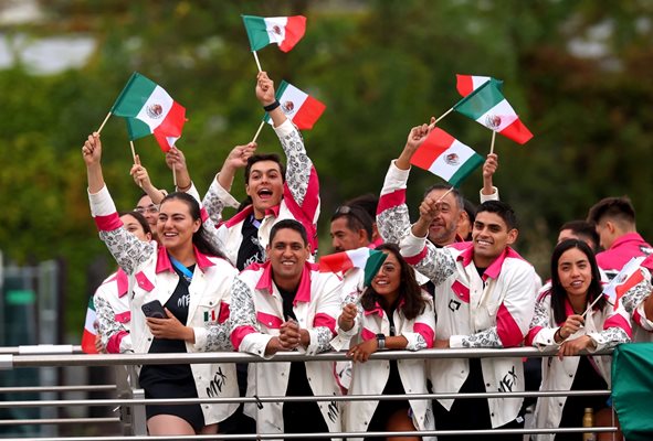 Team Mexico athletes wave hand flags Photo: Reuters