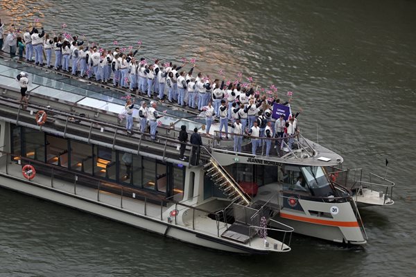 Thomas Daly of Great Britain and Helen Glover of Great Britain travel by boat on the Seine River Photo: Reuters