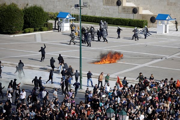 Protesters throw petrol bombs at riot police during a demonstration marking a 24-hour general strike, in Athens, Greece, November 9, 2022. REUTERS/Alkis Konstantinidis GREECE OUT. NO EDITORIAL SALES IN GREECE.