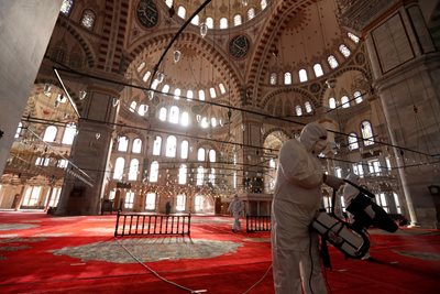 Medical workers disinfect a mosque in Turkey.  PHOTO: Reuters