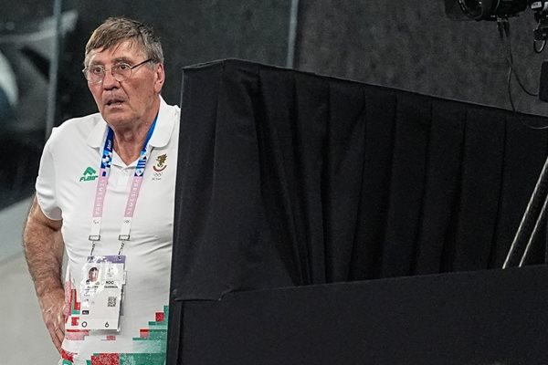 Minister Georgi Glushkov watches badminton in the hall in Paris.