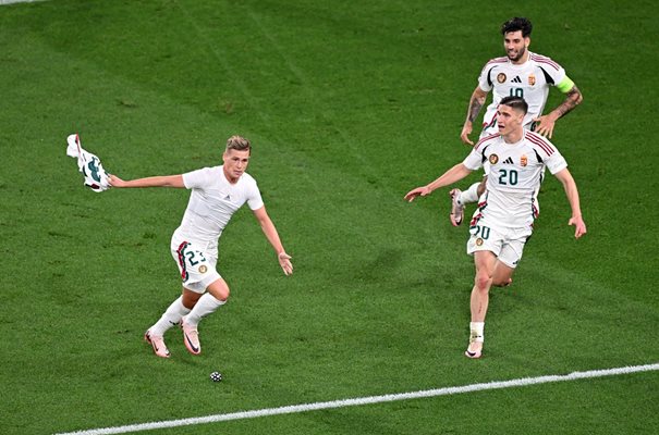 Chobot has taken off his shirt and is jubilant after scoring the winning goal for Hungary.